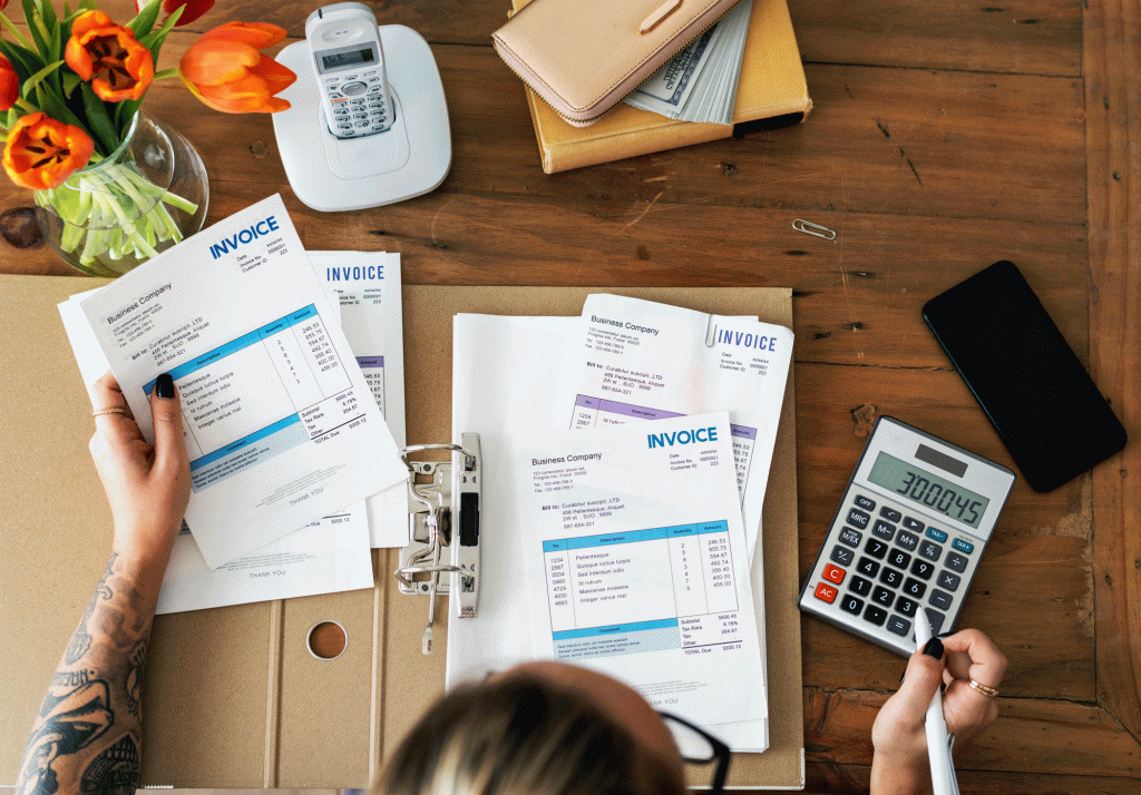 Woman sorting through invoices